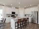 Modern kitchen with white cabinets, stainless steel appliances, and a central island with bar seating at 4360 Falls Oaks St., Myrtle Beach, SC 29579