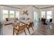 Stylish living room with comfortable seating, natural light, and a smooth transition to the dining area at 4360 Falls Oaks St., Myrtle Beach, SC 29579