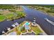 Amazing aerial view highlighting waterfront community, lighthouse, pool, clubhouse, and extensive boat docks at 4755 Lightkeepers Way # 15-E, Little River, SC 29566