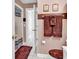 Stylish bathroom with brown towels, decorative artwork, and a decorative shower curtain at 4755 Lightkeepers Way # 15-E, Little River, SC 29566