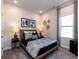 Cozy bedroom with modern decor, neutral paint, recessed lighting, and a large window that provides plenty of light at 4827 Hopespring St., Myrtle Beach, SC 29579