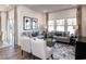 Comfortable living room featuring neutral tones, contemporary furniture, recessed lighting, and lots of natural light at 4827 Hopespring St., Myrtle Beach, SC 29579