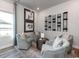Inviting sitting area with comfortable chairs and a stylish wine rack display at 4827 Hopespring St., Myrtle Beach, SC 29579