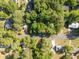 Overhead view of a property surrounded by lush, mature trees in a neighborhood setting at 508 Pearl St., Conway, SC 29527