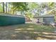 View of the backyard of the house with a patio table and additional outbuildings at 508 Pearl St., Conway, SC 29527
