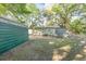 Private backyard featuring a patio, storage sheds, and lush greenery at 508 Pearl St., Conway, SC 29527