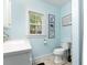 Bright bathroom with a single sink vanity, tile floors, and decor at 508 Pearl St., Conway, SC 29527