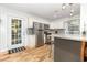 Modern kitchen featuring granite countertops, stainless steel appliances, and white cabinetry at 508 Pearl St., Conway, SC 29527