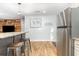 Charming eat-in kitchen featuring stainless steel appliances, a breakfast bar, and wood-look floors at 508 Pearl St., Conway, SC 29527