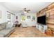 Bright living room with a wooden accent wall and hardwood floors at 508 Pearl St., Conway, SC 29527