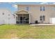 Picture of a nice yard with lawn, patio and screened in porch with a fence around it at 524 Cottage Oaks Circle, Myrtle Beach, SC 29579
