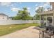 Fenced backyard with concrete patio, lawn, and screened-in porch for outdoor enjoyment at 524 Cottage Oaks Circle, Myrtle Beach, SC 29579
