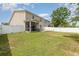 Spacious backyard with a patio, lawn, a screened-in porch and privacy fence at 524 Cottage Oaks Circle, Myrtle Beach, SC 29579