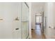 Walk-in shower, a view of the hallway, and the bedroom at 524 Cottage Oaks Circle, Myrtle Beach, SC 29579