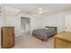 Bedroom with a zebra-striped bed and tan carpeting with a view into another room at 524 Cottage Oaks Circle, Myrtle Beach, SC 29579