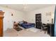 This bedroom has carpet and a ceiling fan with a black bookshelf and a desk and chair at 524 Cottage Oaks Circle, Myrtle Beach, SC 29579