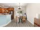 Bright dining area with wood floors, modern lighting, and sliding door access at 524 Cottage Oaks Circle, Myrtle Beach, SC 29579