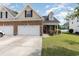 Charming home with brick facade, well-kept lawn, and attached two-car garage at 524 Cottage Oaks Circle, Myrtle Beach, SC 29579