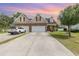 Charming home boasts a brick facade, two-car garage, and well-manicured lawn at 524 Cottage Oaks Circle, Myrtle Beach, SC 29579