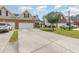 Charming two-story brick home with a well-manicured lawn and a spacious three car driveway at 524 Cottage Oaks Circle, Myrtle Beach, SC 29579