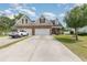 Charming two-story brick home with a well-manicured lawn and a spacious three car driveway at 524 Cottage Oaks Circle, Myrtle Beach, SC 29579