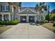 Two-car garage showcasing ample space for vehicles, bicycles, and other storage needs and a wide driveway at 546 Olde Mill Dr., North Myrtle Beach, SC 29582
