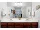 Spacious bathroom featuring a double sink vanity, decorative towels, and ample cabinet space at 5876 Longwood Dr. # 201, Murrells Inlet, SC 29576