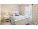 Guest bedroom featuring a full bed, beach themed decor, and bright window at 5876 Longwood Dr. # 201, Murrells Inlet, SC 29576