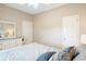 Cozy bedroom featuring neutral walls, a ceiling fan, and blue patterned bedding at 5876 Longwood Dr. # 201, Murrells Inlet, SC 29576
