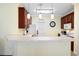 Eat-in kitchen features pendant lights, marble countertops, white appliances, and tile floors at 5876 Longwood Dr. # 201, Murrells Inlet, SC 29576