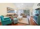 Bright living room with comfortable seating, beach-themed décor, and access to a private balcony at 5876 Longwood Dr. # 201, Murrells Inlet, SC 29576