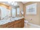 Bathroom features granite counters, wood cabinets, and modern fixtures at 600 Waterbridge Blvd., Myrtle Beach, SC 29579