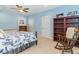 Cozy bedroom with a rocking chair, bookshelf, and comfortable bed with patterned bedding at 600 Waterbridge Blvd., Myrtle Beach, SC 29579