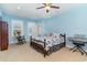 Bright bedroom with a rocker, keyboard, and cozy nautical themed bedding and decor at 600 Waterbridge Blvd., Myrtle Beach, SC 29579