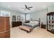 Comfortable bedroom featuring a ceiling fan, dresser, and ample natural light at 600 Waterbridge Blvd., Myrtle Beach, SC 29579