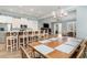 Open dining area with barstool seating, chandelier, and modern decor at 600 Waterbridge Blvd., Myrtle Beach, SC 29579