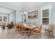 Dining room showcasing a large table, seating for eight, and stylish lighting at 600 Waterbridge Blvd., Myrtle Beach, SC 29579