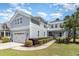 Charming two-story home with a manicured lawn, two car garage, and lush landscaping at 600 Waterbridge Blvd., Myrtle Beach, SC 29579