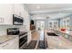 Bright kitchen featuring granite counters, stainless appliances, and backyard view at 600 Waterbridge Blvd., Myrtle Beach, SC 29579
