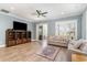 Cozy living room with tile floors, ceiling fan, and sliding doors to outdoor space at 600 Waterbridge Blvd., Myrtle Beach, SC 29579