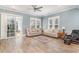 Bright living room with wood floors, neutral furniture, and a ceiling fan at 600 Waterbridge Blvd., Myrtle Beach, SC 29579