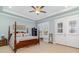 Spacious main bedroom with decorative tray ceiling, ceiling fan and private balcony at 600 Waterbridge Blvd., Myrtle Beach, SC 29579