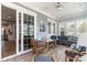 Relaxing sunroom with a glass table, comfortable seating, and plenty of natural light at 600 Waterbridge Blvd., Myrtle Beach, SC 29579