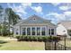 Charming home with a large sunroom and lush landscaping at 600 Waterbridge Blvd., Myrtle Beach, SC 29579