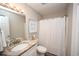Bathroom features a vanity with granite top, framed star fish art, and a shower at 649 Tupelo Ln. # 13A, Longs, SC 29568