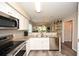 Spacious kitchen opens to the living area with stainless steel appliances at 649 Tupelo Ln. # 13A, Longs, SC 29568