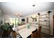 Open floor plan living area with dining area, sliding doors, and bamboo shelving at 649 Tupelo Ln. # 13A, Longs, SC 29568