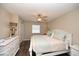 Calm main bedroom featuring hardwood style floors, a ceiling fan, and neutral decor at 649 Tupelo Ln. # 13A, Longs, SC 29568