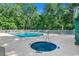 Community pool with hot tub, sun loungers, and lush green landscaping at 649 Tupelo Ln. # 13A, Longs, SC 29568