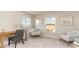 Well-lit home office featuring a desk, chairs, and peaceful view of the water at 728 Choctaw Dr., Conway, SC 29526